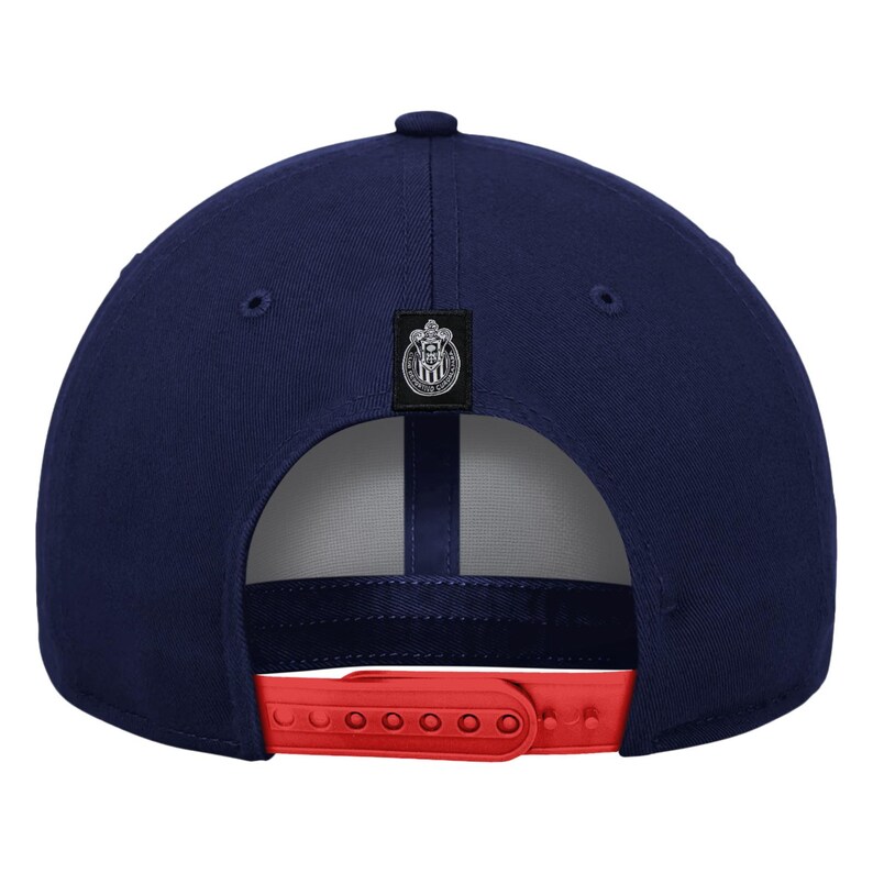 May include: Navy blue baseball cap with a red adjustable strap. The cap features a team logo patch on the back and a button on top. The cap is a classic style, suitable for sports or casual wear.