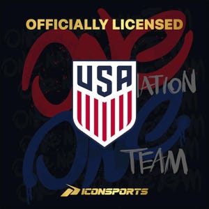 May include: A graphic with the text "OFFICIALLY LICENSED" in gold. The image features a shield with the letters "USA" and red and white stripes. The words "ONE TEAM" and "NATION" are also visible.