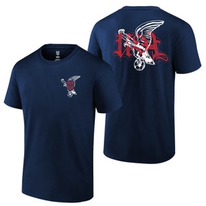 May include: A navy blue t-shirt with a white eagle graphic on the front and a larger white eagle graphic with the text "USA" on the back.