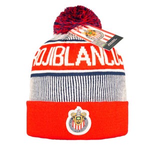 May include: A red, white, and blue knit beanie with the word "ROJIBLANCOS" in white block letters. The beanie features a team logo on the front and a red and blue pom-pom on top. A tag is attached.