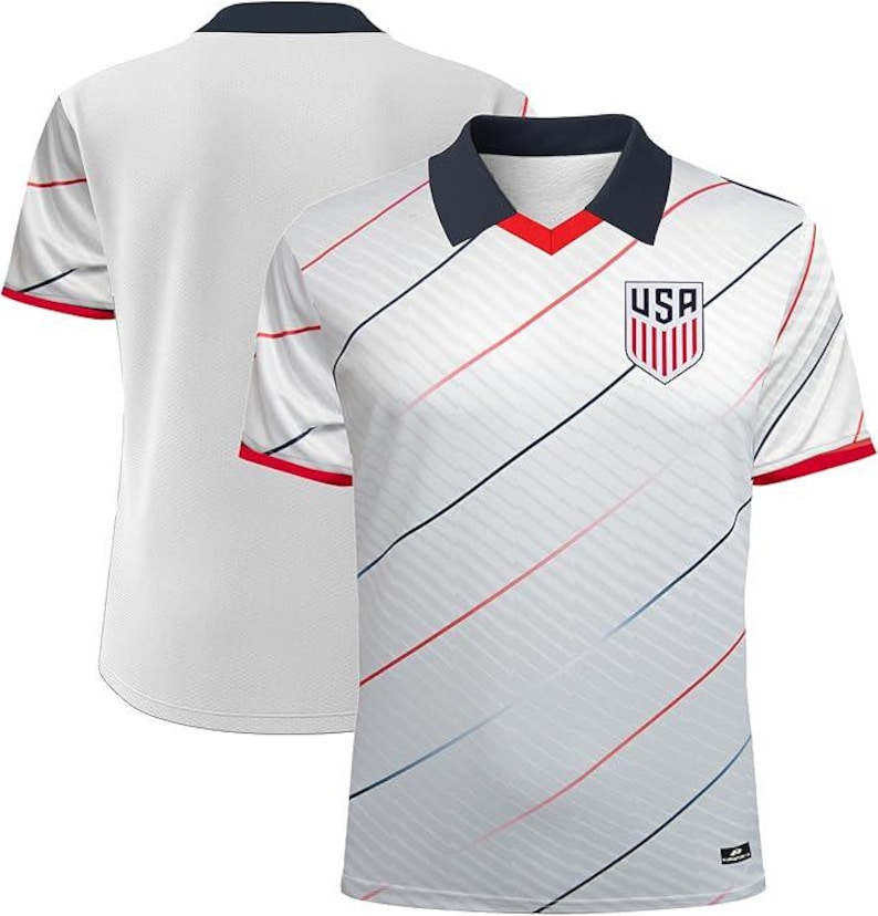 May include: White football shirt with a navy collar and red trim. The shirt has diagonal stripes in red, blue, and black. A USA crest is on the chest. The back of the shirt is plain white.