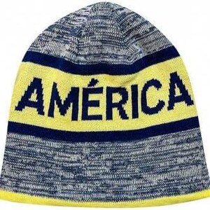 May include: A grey and yellow knitted beanie with the word "AMÉRICA" in blue lettering.