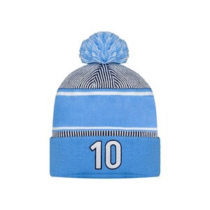 May include: A light blue knitted beanie hat with a light blue pom-pom. The hat has a white stripe and the number "10" in white. The top of the hat has a navy and white striped pattern.