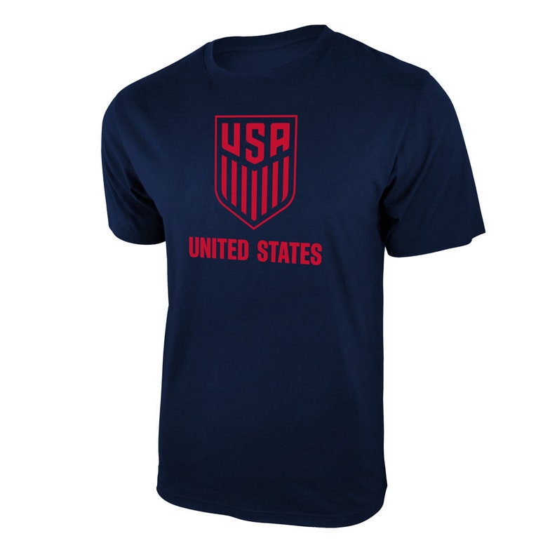 May include: A navy blue t-shirt with a red USA logo and the words "UNITED STATES" printed on the front.