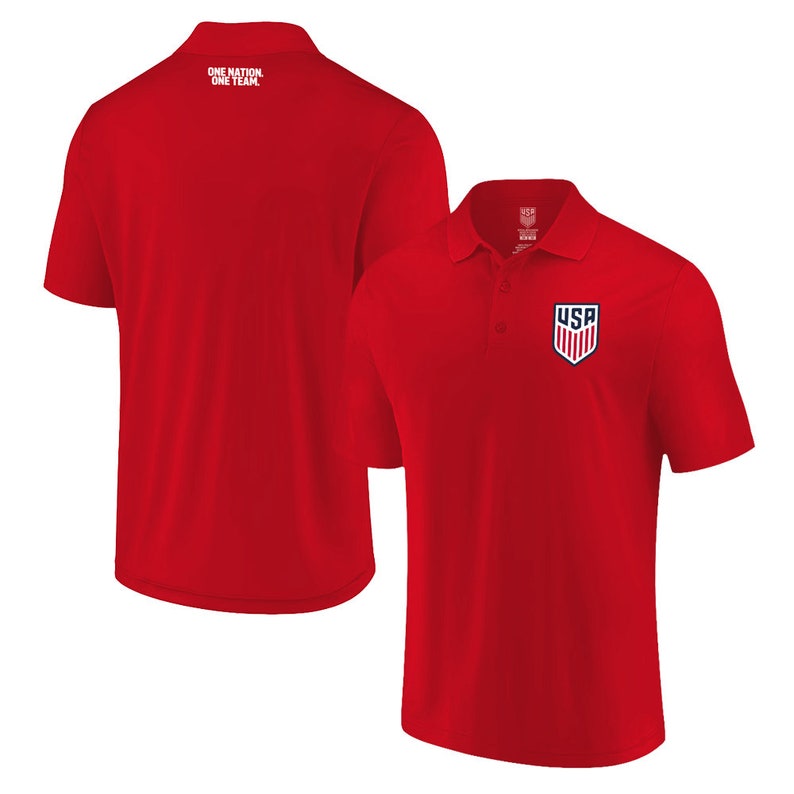 May include: Red short-sleeved polo shirt with a small embroidered USA logo on the left chest. The back of the shirt has the text "ONE NATION, ONE TEAM" printed in white.