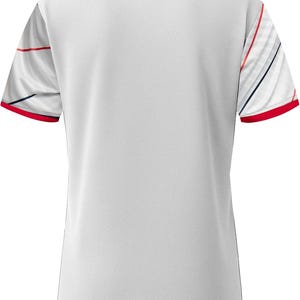 May include: White athletic shirt with a navy blue collar and red trim on the sleeves. The sleeves have a white base with red and navy blue diagonal stripes. The shirt has a textured appearance.
