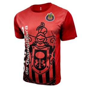 May include: Red and black soccer jersey with a white crest featuring a rooster and the text "Club Deportivo Guadalajara".
