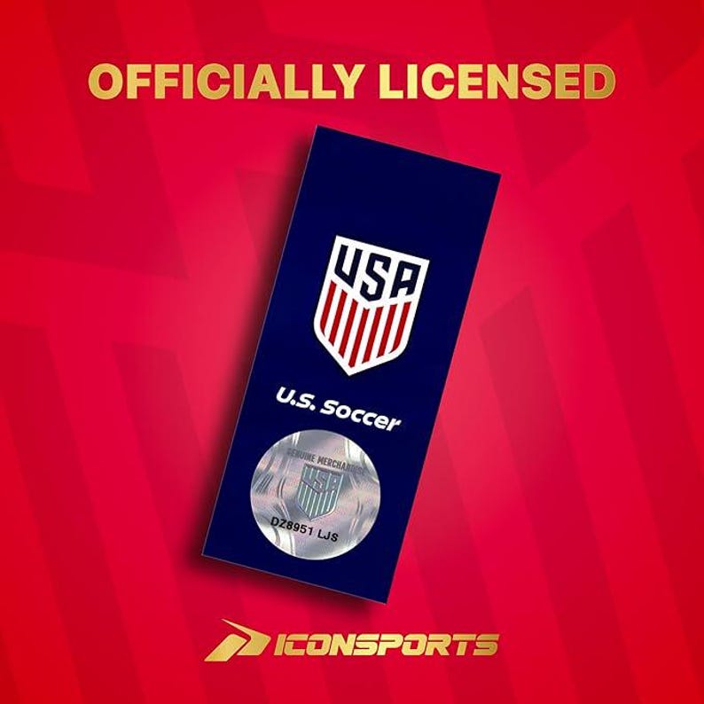 May include: A rectangular dark blue tag featuring the white and red U.S. Soccer crest, the text U.S. Soccer, and a circular silver holographic sticker with the U.S. Soccer logo and code DZ8951 LJS. The text OFFICIALLY LICENSED and ICONSPORTS appear in gold.