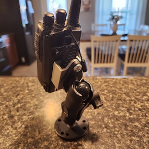 Radio clip mount.  Wall mount, ram mount, or tripod mount.  Anytone Yaesu Baofeng