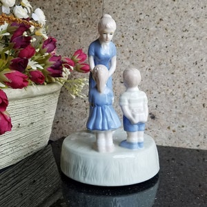Vintage Mother and Children Figurine Porcelain Music Box
