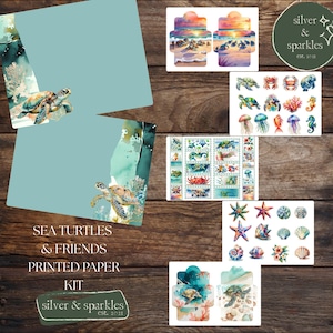 May include: A collection of sea-themed stationery and decorative elements. The image features printed paper, cards, and stickers with watercolor illustrations of sea turtles, starfish, jellyfish, and other marine life. The text "SEA TURTLES & FRIENDS PRINTED PAPER KIT" is visible.