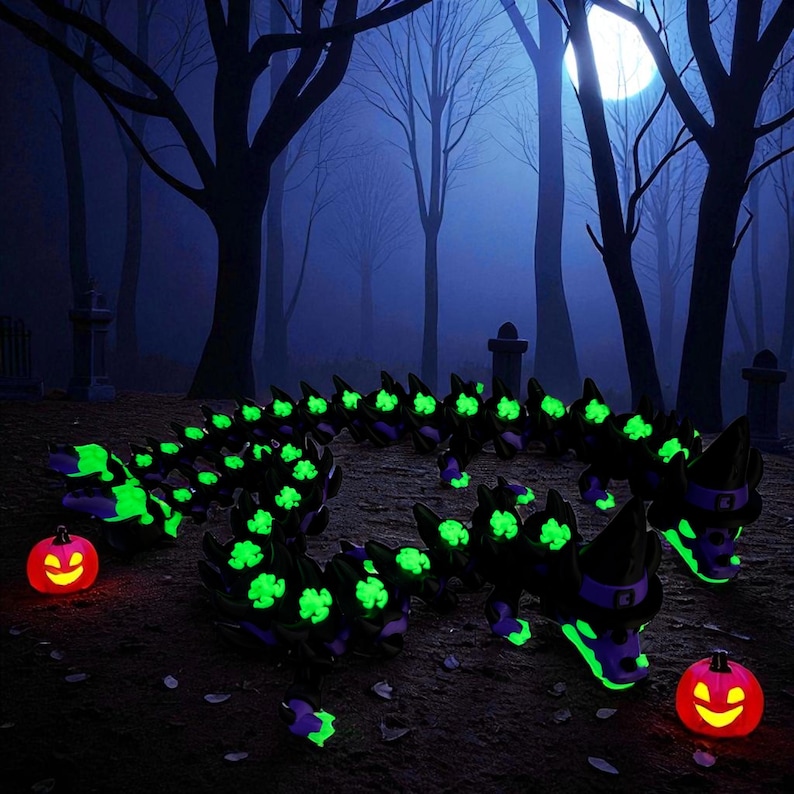 May include: A Halloween-themed scene featuring a glowing, segmented creature with green accents and a witch hat, along with two illuminated jack-o'-lanterns. The setting is a spooky forest with a full moon.