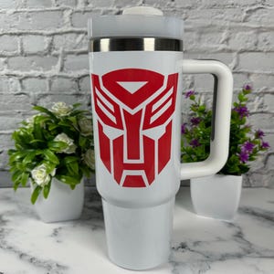 40oz Cartoon Tumbler Retro 80s Stanley Dupe Show off your fandom with this sleek and durable tumbler. Perfect for staying hydrated in style!