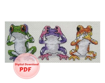 May include: Three colorful frog cross stitch patterns. The frogs are in a row and are covering their eyes, ears, and mouth. The frogs are green, purple, and orange.