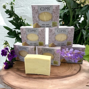 May include: Five bars of yellow sulfur soap with the brand name "EDMIS" printed on the packaging. The soap is labeled "DOĞAL SABUN KÜKÜRT SABUNU" which translates to "Natural Soap Sulfur Soap".