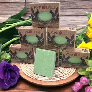May include: Six bars of green organic olive oil soap with brown paper packaging. The packaging has the text "Edmis Edirne Meyve Sabunlari" and "%100 Organik Zeytinyağlı Bitkisel Sabun".