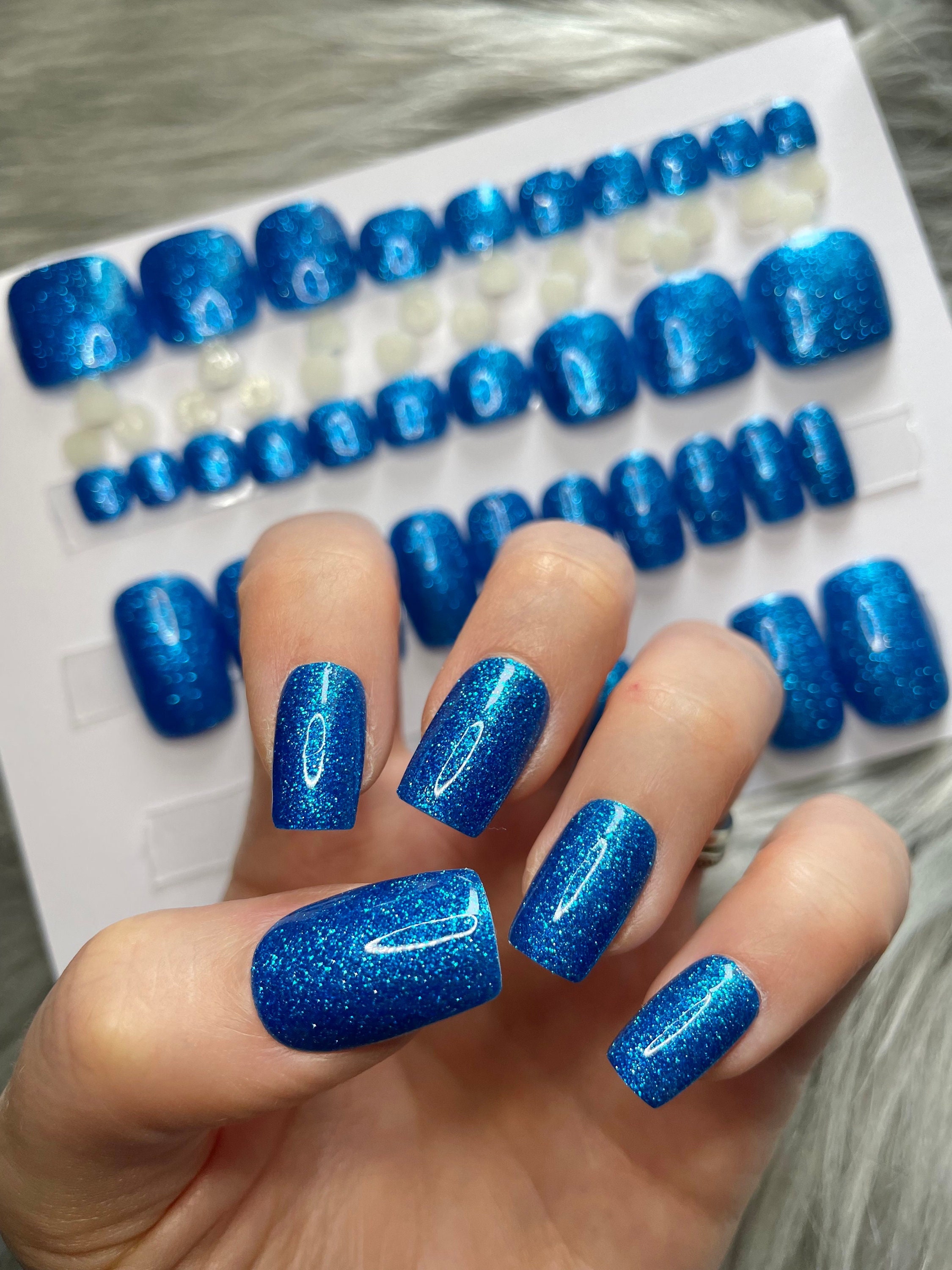 Match your jeans with a deep blue manicure at Fairynails