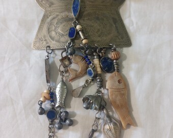 Vintage Pin of etched fish on a silver brooch with many dangles of more fish beads and silver shaped dangles early 1990's from Alaska