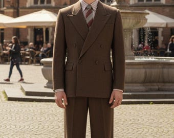 May include: A brown double-breasted suit with a matching pair of trousers. The suit features a notched lapel and a classic fit. The person is wearing a striped shirt and a patterned tie. The background includes a fountain and a European-style plaza.