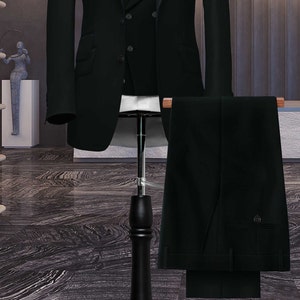 May include: A black three-piece suit with a double-breasted jacket, a vest, and matching pants.