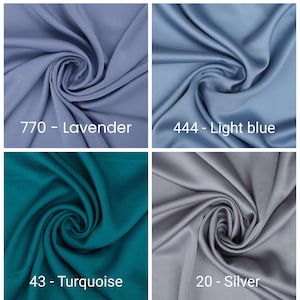 May include: Four fabric swatches in lavender, light blue, turquoise, and silver. Each swatch is swirled to show the fabric's texture and sheen. The colors are labeled with their names and numbers: 770 - Lavender, 444 - Light blue, 43 - Turquoise, and 20 - Silver.