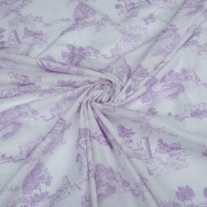 May include: White fabric with a lavender-colored print of a countryside scene. The print features trees, houses, and other details.