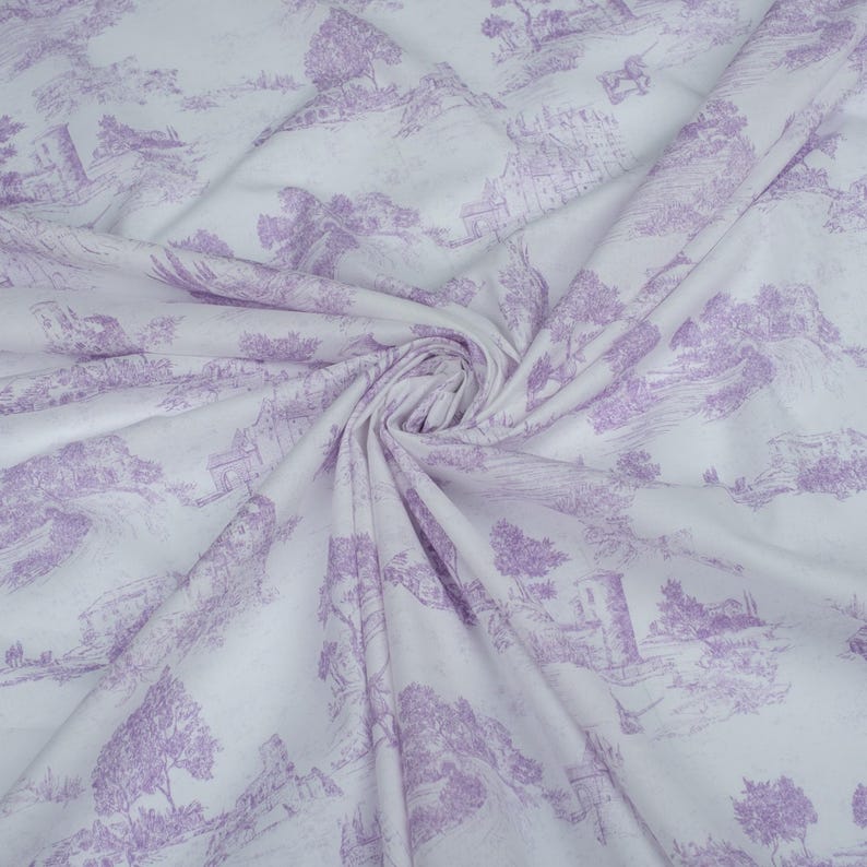 May include: White fabric with a lavender-colored print of a countryside scene. The print features trees, houses, and other details.