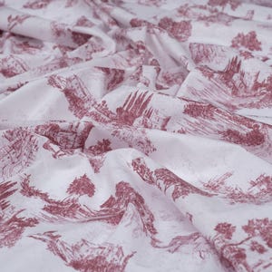 May include: White fabric with a repeating pattern of a red-brown ink drawing of a landscape with trees and buildings.