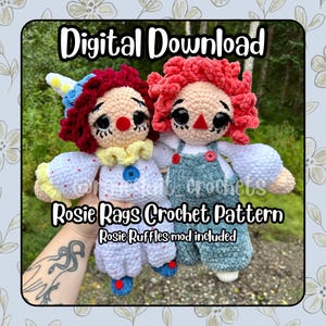 May include: Two handmade crochet dolls with large black eyes and yarn hair. One doll wears a white outfit with a blue button and a blue hat, while the other wears blue overalls over a white shirt. Text reads Digital Download, Rosie Rags Crochet Pattern, Rosie Ruffles mod included.