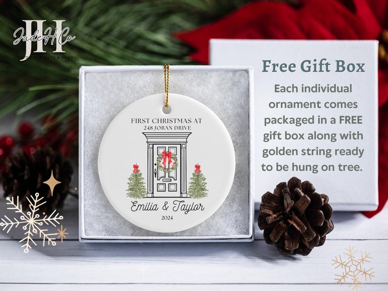 May include: White ceramic Christmas ornament with a house illustration and the text "First Christmas at 248 Joran Drive Emilia & Taylor 2024".
