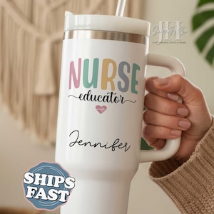 May include: White insulated tumbler with a handle, featuring the words "NURSE educator" in pastel colors, a heart graphic, and the name "Jennifer" in black script. Includes a straw and a white lid.