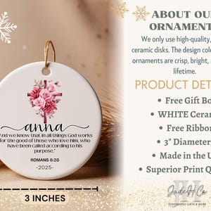 May include: White ceramic ornament, 3 inches in diameter, featuring a floral cross design with the name "anna" and a Bible verse. Includes a gold string for hanging. The text reads "And we know that in all things God works..."