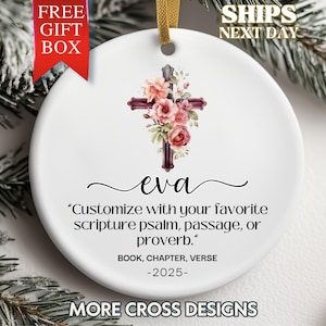 May include: White ceramic ornament with a burgundy cross adorned with pink and peach flowers. The name "eva" is written below the cross, with text that reads "Customize with your favorite scripture psalm, passage, or proverb."