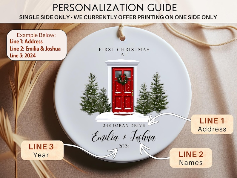 May include: White ceramic Christmas ornament with a red door, two green trees, and the text "First Christmas At" and "248 Joran Drive Emilia + Joshua 2024".