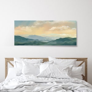 May include: A panoramic landscape painting of a mountain range with a soft, hazy sky in shades of blue, yellow, and orange. The mountains are a deep green color and appear to be covered in trees.