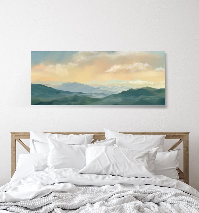 May include: A panoramic landscape painting of a mountain range with a soft, hazy sky in shades of blue, yellow, and orange. The mountains are a deep green color and appear to be covered in trees.