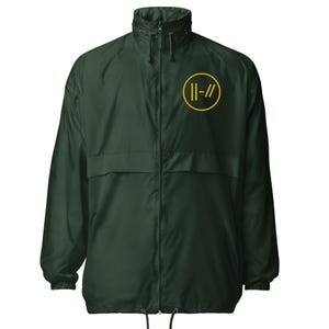 May include: Dark green windbreaker jacket with a yellow circle logo on the chest. The jacket has a full zip, a stand-up collar, and two front pockets. The logo features two vertical lines and two forward slashes.
