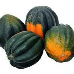 May include: Four acorn squash, two green and two with orange and green markings.