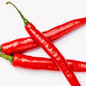 May include: Three red chili peppers, with green stems, are arranged in a criss-cross pattern on a white background.