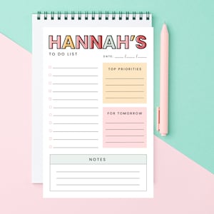 May include: A white to-do list printable with the title "HANNAH'S TO DO LIST" in colorful letters. The printable has sections for "Top Priorities", "For Tomorrow", and "Notes".