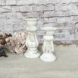 Pair of Ornate Ceramic Candlesticks