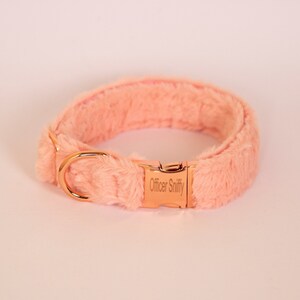May include: A soft pink faux fur dog collar with a rose gold buckle and D-ring. The buckle is engraved with the text "Officer Sniffy".