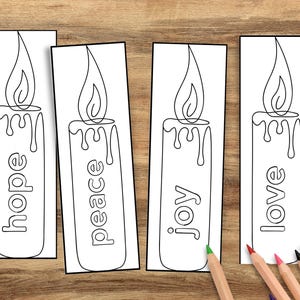 May include: Four white rectangular bookmarks with black line drawings of candles. Each candle has a flame and the words "hope", "peace", "joy", and "love" printed vertically. Colored pencils are scattered on a wooden surface.