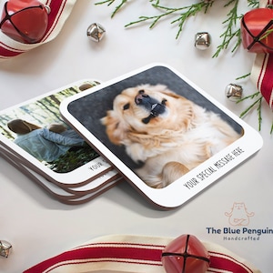 May include: Set of four square photo coasters with rounded corners. The coasters feature a white border with black text that reads "Your special message here". The coasters are stacked on top of each other. The top coaster features a photo of a golden retriever dog. The bottom coaster features a photo of two people in a forest. The coasters are handcrafted by The Blue Penguin.