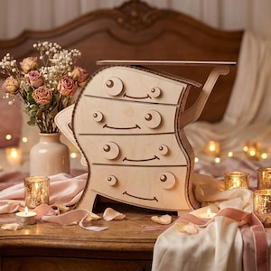 May include: A whimsical wooden dresser with four drawers, featuring a unique, curved design. The dresser has circular knobs and smiling face details. The scene includes a vase of flowers, candles, and a bed in the background.