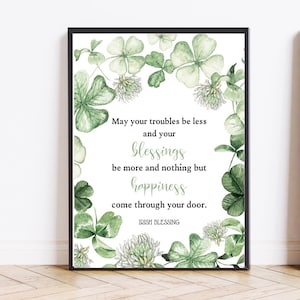 May include: A white background with a black frame around a watercolour illustration of green shamrocks and white clover flowers. The text reads "May your troubles be less and your blessings be more and nothing but happiness come through your door. Irish Blessing."