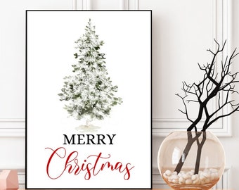 May include: A framed print with a watercolor illustration of a Christmas tree, with the words "MERRY Christmas" in red script. The print is displayed on a wooden shelf with decorative vases and a glass vase with branches.