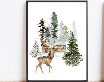 May include: Watercolor print of a winter scene featuring a deer, a cabin with lit windows, and evergreen trees. The artwork is framed in a black frame and set against a white background. The deer is brown with snow on its antlers.