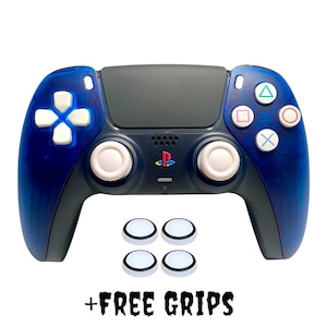 May include: A blue and black PlayStation 5 controller with white buttons and thumbsticks. The controller is on a white background with four white round grips.