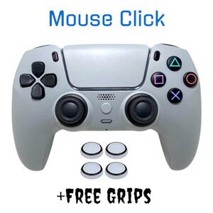 May include: A gray PlayStation 5 controller with black buttons and analog sticks. The controller has a white faceplate with the PlayStation logo. The controller is accompanied by four white and black thumb grips. The text "Mouse Click + FREE GRIPS" is printed below the controller.